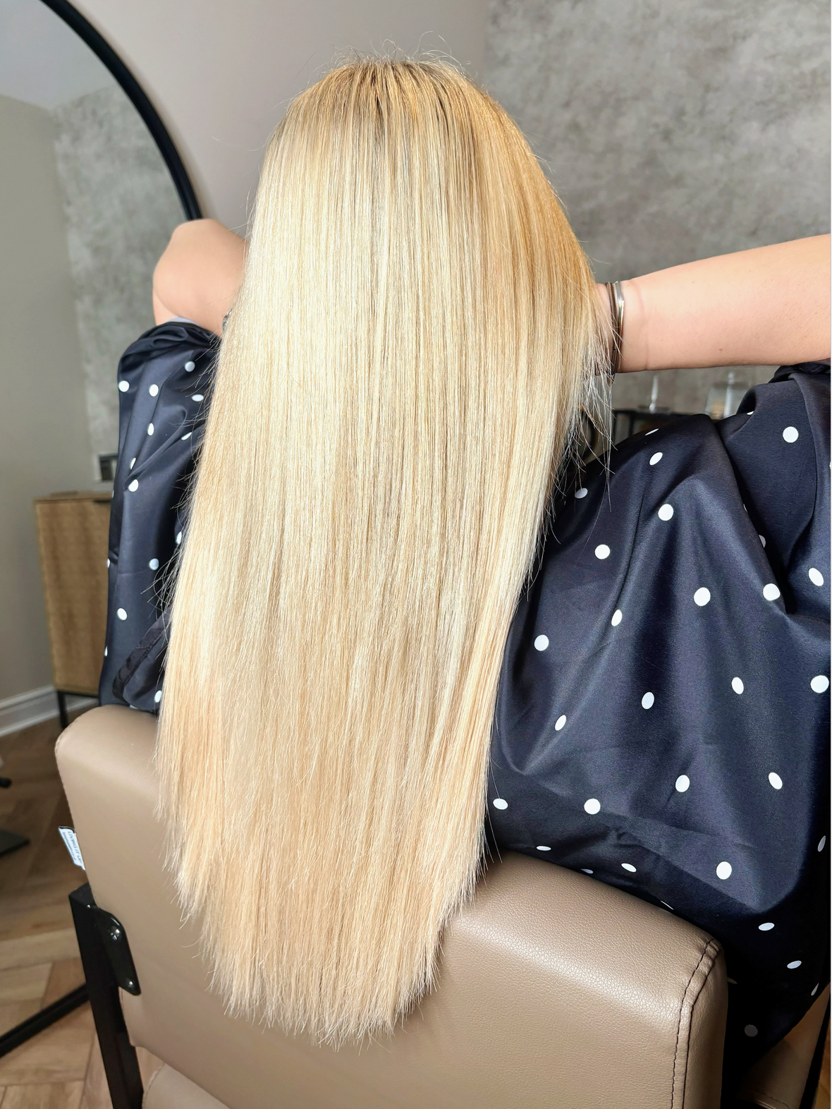 Flowing hair with lightweight tape extensions.